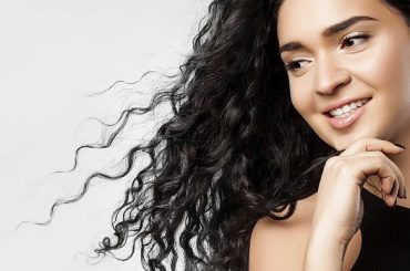 Hairstyles that will make curly hair look longer